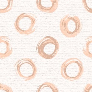 Hand drawn watercolour circles and rings – painted geometric brush strokes on a warm cream watercolour paper texture. Beige and ecru with peach fuzz and apricot orange.