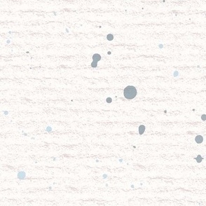 Hand drawn watercolour paint splashes and speckles – painted brush strokes on a warm cream watercolour paper texture. Beige and ecru with thermal blue and baby blue.