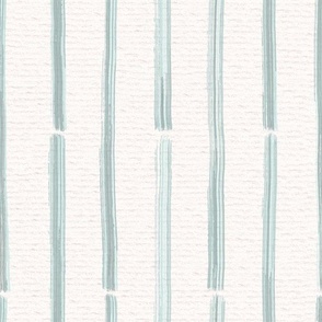 Hand drawn half inch watercolour paint striped pattern – painted geometric brush strokes on a warm cream watercolour paper texture. Beige and ecru with renew blue and cyan celadon.