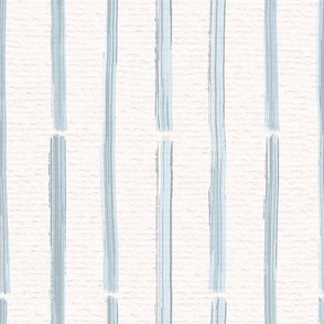 Hand drawn half inch watercolour paint striped pattern – painted geometric brush strokes on a warm cream watercolour paper texture. Beige and ecru with thermal blue and baby blue.