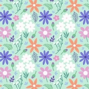 Cheerful flowers / green background 
