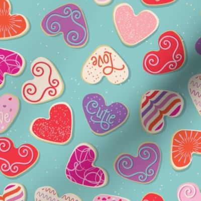 Valentine's Day Sugar Cookies  in Pink, Purple, Orange, and Red on an Aqua Background