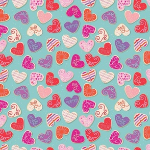 Valentine's Day Sugar Cookies  in Pink, Purple, Orange, and Red on an Aqua Background