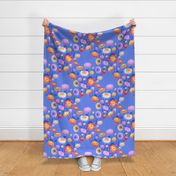 Large vibrant straw flowers in red orange yellow pink and purple on a cornflower blue background in diagonal pattern