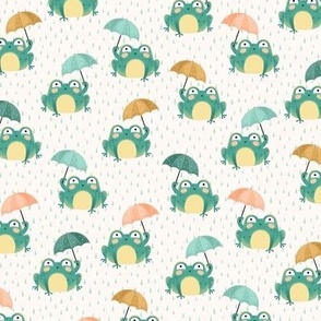 Cute green frogs with umbrellas on cream
