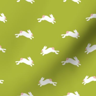 Mini modern bunnies hop in spring for Easter ion a field of green ready for kids wallpaper or bedding.