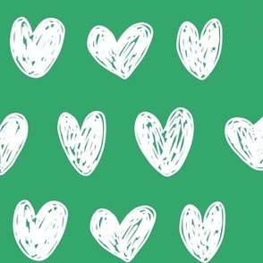 White doodle hearts on Kelly green