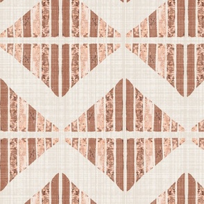 Jumbo - A block printed design of triangles and squares and a graphic zigzag of flax coloured textured linen. Peach fuzz, rust, terracotta and orange.