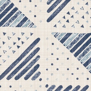 Jumbo - A checkerboard design created from block printed triangular elements on a flax coloured textured linen. Blue nova, indigo, navy and denim.