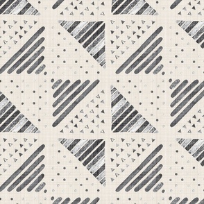 Large - A checkerboard design created from block printed triangular elements on a flax coloured textured linen. Cracked pepper, charcoal, gray and silver.