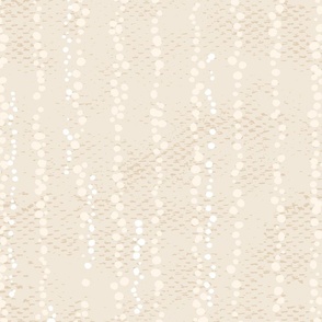 Vertical dots on a textured background in sand