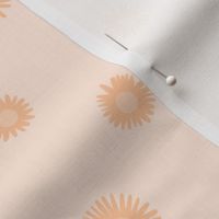 Small ditsy daisies in peach tones