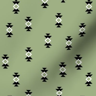 Aztec details - minimalist geometric triangles and squares on green