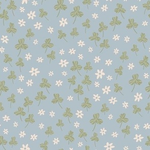 Small flower Meadow featuring daisies and clovers on powder blue, ditsy daisies