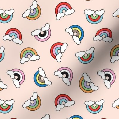 Retro cartoon rainbows and clouds tossed pride design on blush 