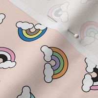 Retro cartoon rainbows and clouds tossed pride design on blush 