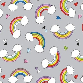 Cartoon style rainbows - lgbtq+ inclusive pride design with hearts on gray 