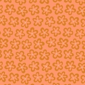 Small groovy floral shapes outlined in apricot orange and ochre