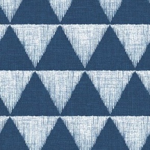 Medium - Hand drawn watercolor triangles checkerboard pattern – painted geometric brush strokes bleaching out the denim texture giving a grungy, faded effect to the dark indigo blue.