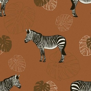 Zebras and monstera leaves warm earthy tones