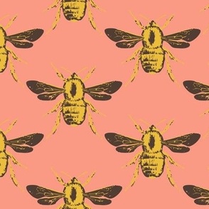 Medium scale bee geometric block print diamond pattern in a vibrant saffron yellow, deep neutral brown and peach pink.