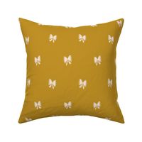 Hand drawn bows in mustard background
