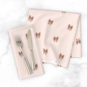 Hand drawn bows in brown color on cream background