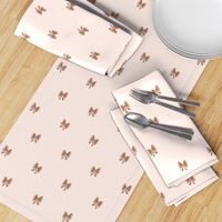 Hand drawn bows in brown color on cream background