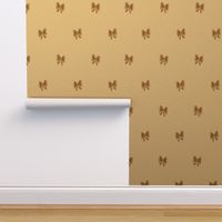 Hand drawn bows in brown color on cream background