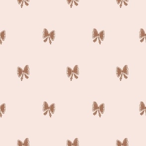 Hand drawn bows in brown color on cream background
