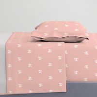 Hand drawn bows in baby pink background