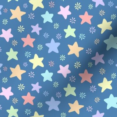 simple pastel stars and small sunbursts on a blue background