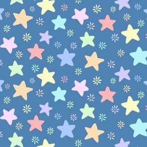 simple pastel stars and small sunbursts on a blue background