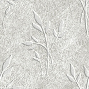 Plaster wall art effect leaves textured pattern soft beige tones. Large scale