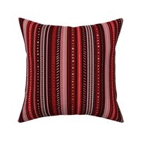 uneven monochromatic stripes with decorative hand drawn detail in burgundy