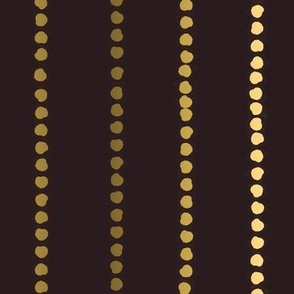 Polka Dot Stripes in gold and cream on black.
