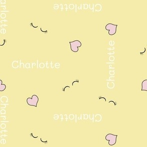 CHARLOTTE baby girl pattern with little hearts and closed eyes on yellow