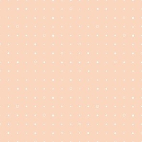 Simple geometric design, white dots on light orange peach