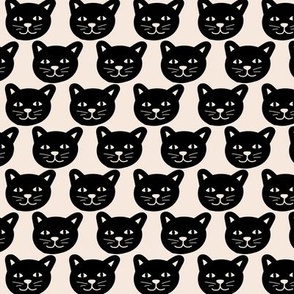 Black cat faces in rows halloween design on cream white