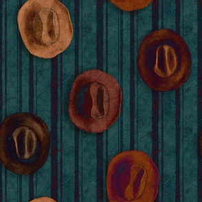 Brown leather Cowboy hats hanging on a teal wall dark blue stripes