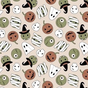 Halloween cutesy monsters - zombie pumpkins ghosts and witches vintage orange green on sand