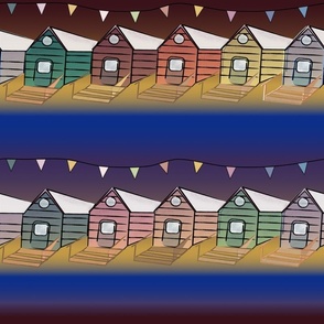 Beach houses and bunting by  night