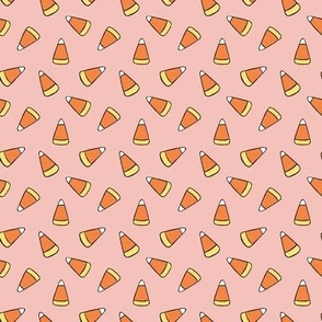 Small Tossed Cartoon Candy Corn in Soft Pink, Orange, and Yellow for Halloween