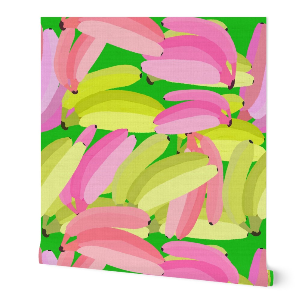 Yellow and Pink Bananas on Green Background