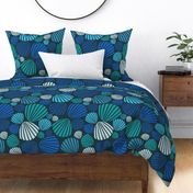 (L) Blue, green, and teal large scale scallop shells tossed on dark charcoal blue for home decor and apparel.
