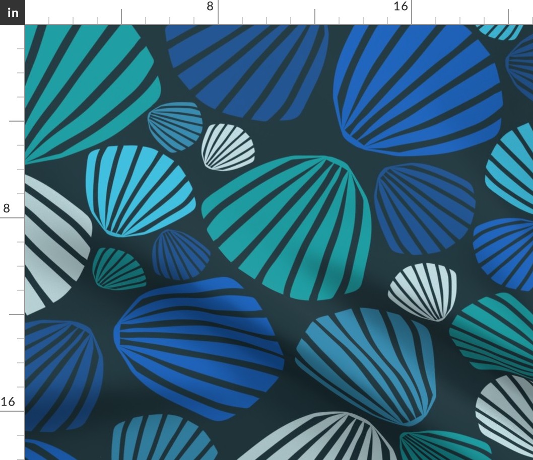 (L) Blue, green, and teal large scale scallop shells tossed on dark charcoal blue for home decor and apparel.