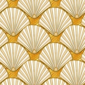 gold scallop shells on textured ground 