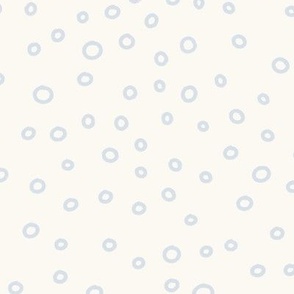 Ocean Life: Hand-Drawn Baby Blue Water Bubbles on a Cream Background
