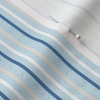 thin vertical blue and yellow stripes on textured light blue | medium