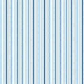 thin vertical blue and yellow stripes on textured light blue | medium